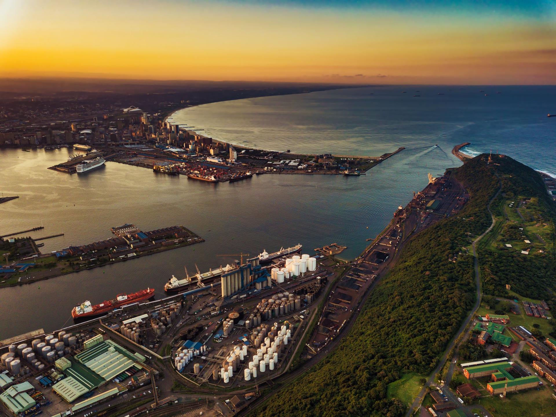 Aerial view of a commercial port at sunset